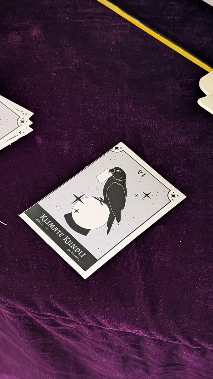 A printed kundli card resting on the purple velvet table
